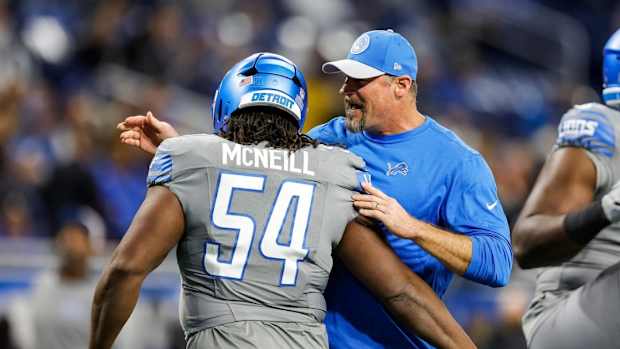 Detroit Lions defensive tackle Alim McNeill embraces coach Dan Campbell.